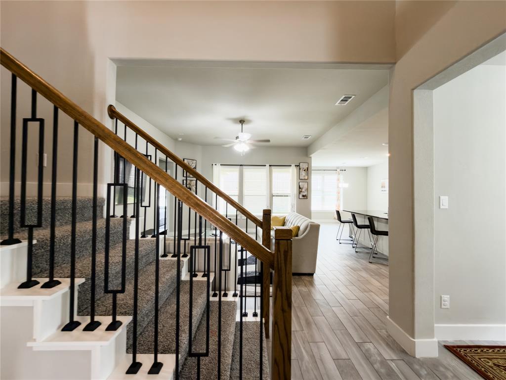 113 Nathan Drive Princeton, TX 75407 - Photo 4 of 40 a view of entryway with wooden floor and stairs