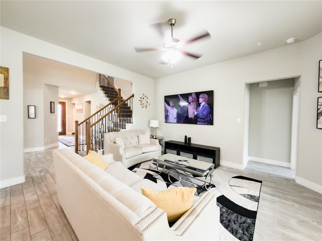 113 Nathan Drive Princeton, TX 75407 - Photo 5 of 40 a living room with furniture and a flat screen tv