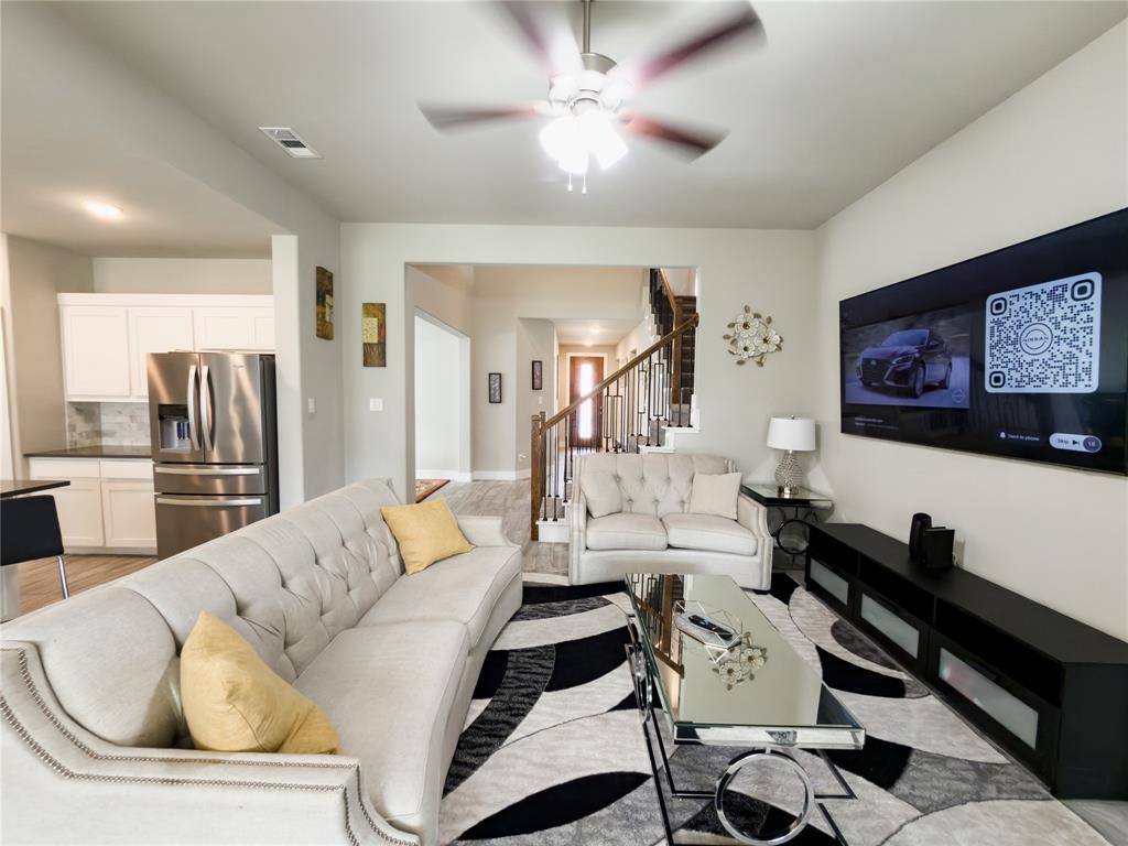 113 Nathan Drive Princeton, TX 75407 - Photo 6 of 40 a living room with furniture and a flat screen tv