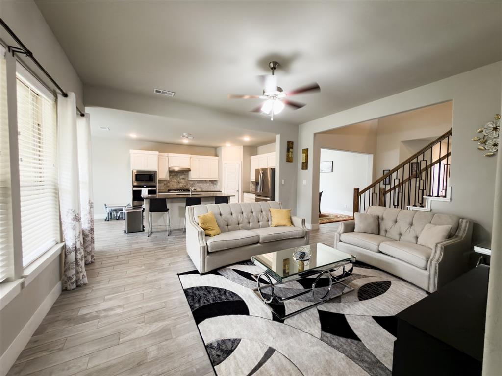 113 Nathan Drive Princeton, TX 75407 - Photo 7 of 40 a living room with furniture and a view of kitchen