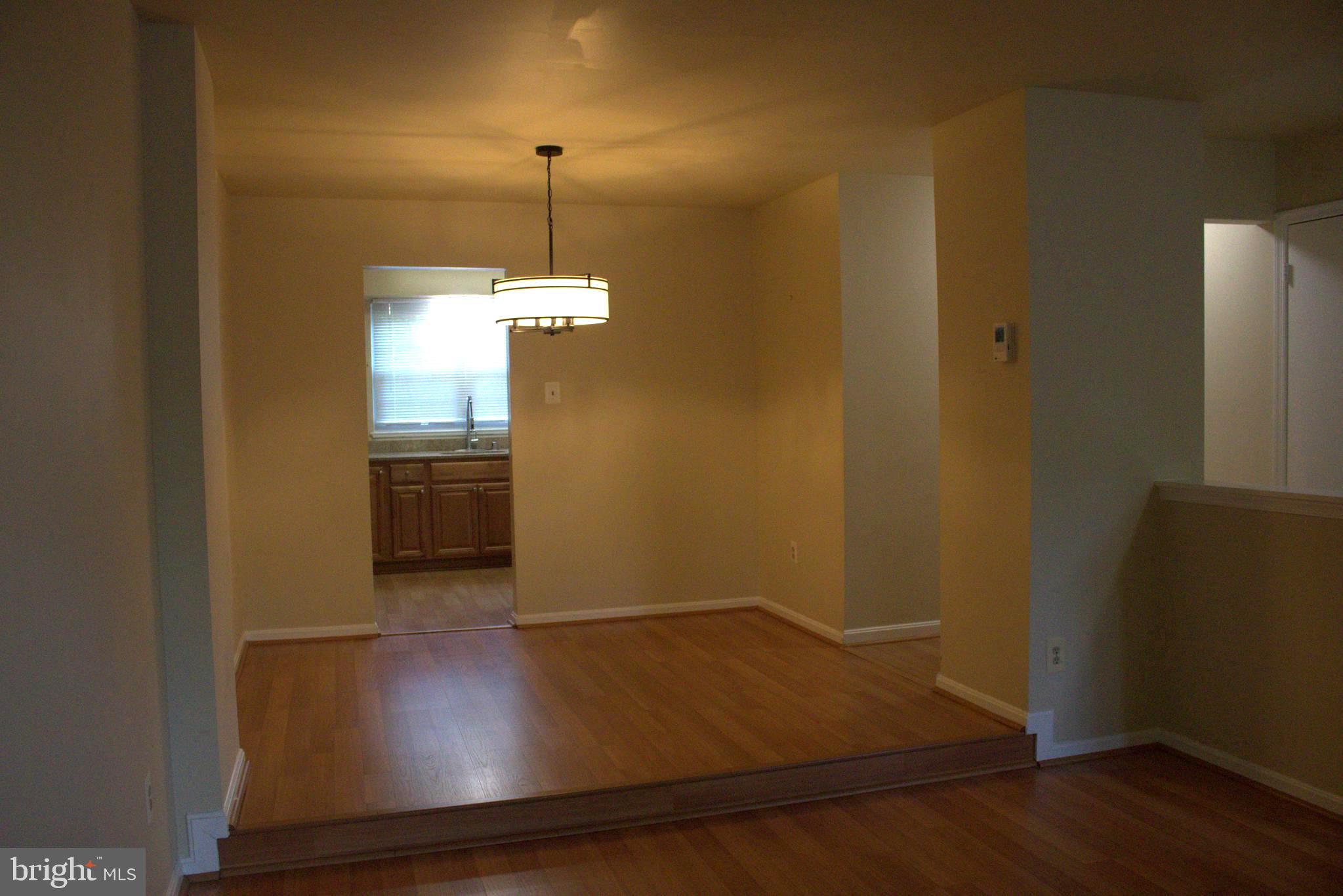17 Habersham Court Silver Spring, MD 20906 - Photo 13 of 40 a view of kitchen and hallway with wooden floor