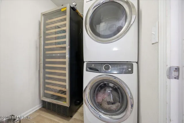 a view of a hallway with washer and dryer