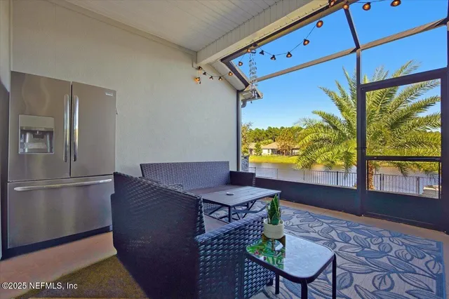 a dining room with furniture and a window