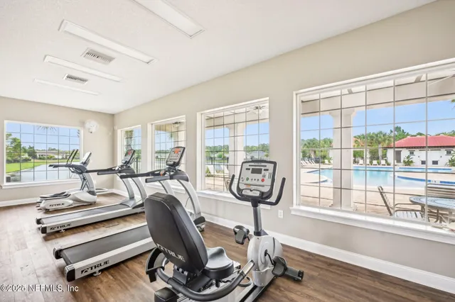 a very nice looking room with a large window and furniture