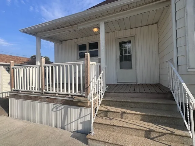 a view of entryway with wooden floor