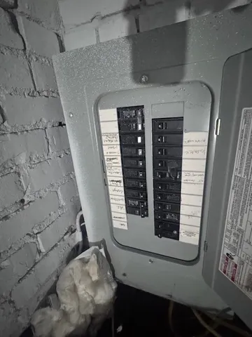 a view of a livingroom with an empty space and a window