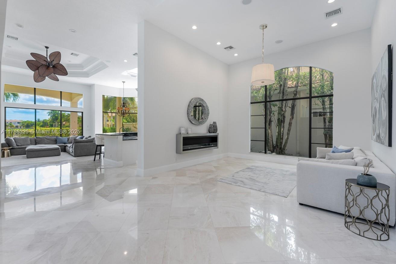 17937 Villa Club Way Boca Raton, FL 33496 - Photo 12 of 41 a living room with furniture and a large window
