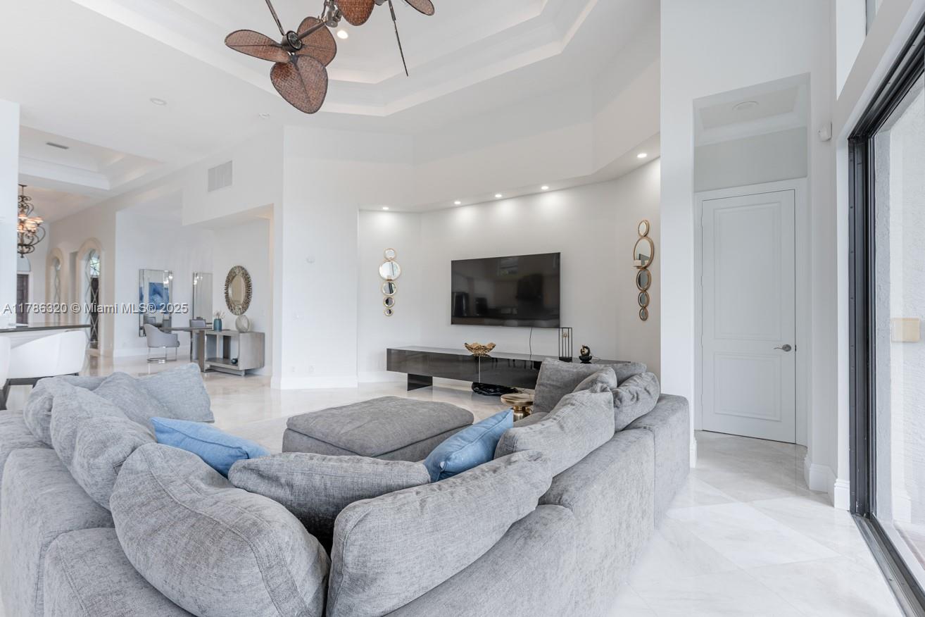17937 Villa Club Way Boca Raton, FL 33496 - Photo 13 of 41 a living room with furniture and a flat screen tv