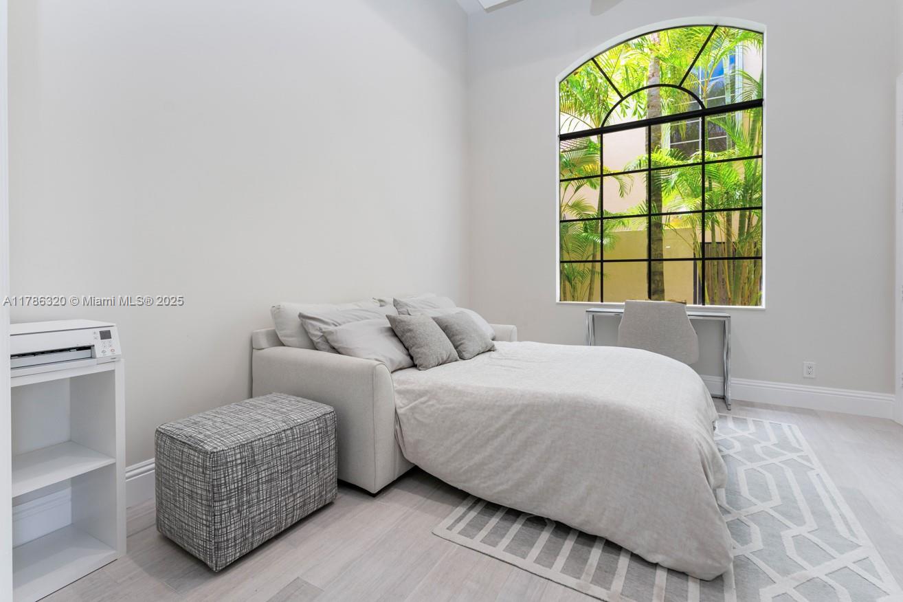 17937 Villa Club Way Boca Raton, FL 33496 - Photo 27 of 41 a bedroom with a bed and a window