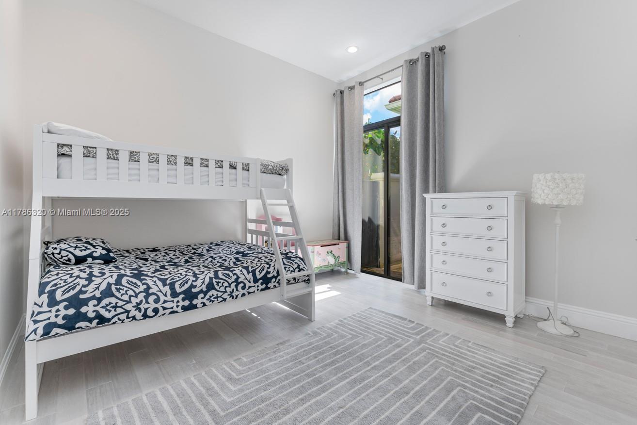 17937 Villa Club Way Boca Raton, FL 33496 - Photo 33 of 41 a bedroom with a bed and a window