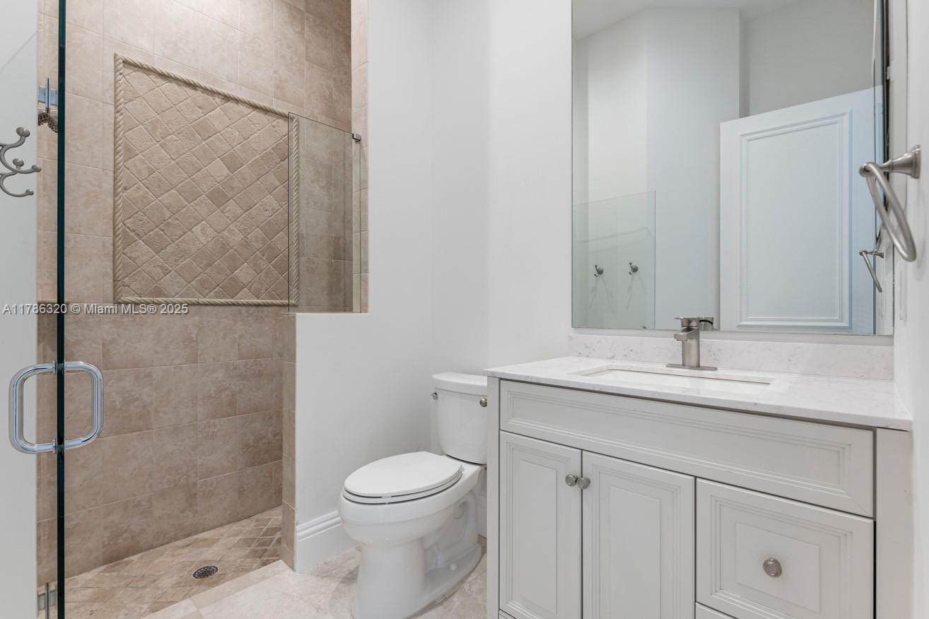 17937 Villa Club Way Boca Raton, FL 33496 - Photo 34 of 41 a bathroom with a granite countertop sink toilet and shower