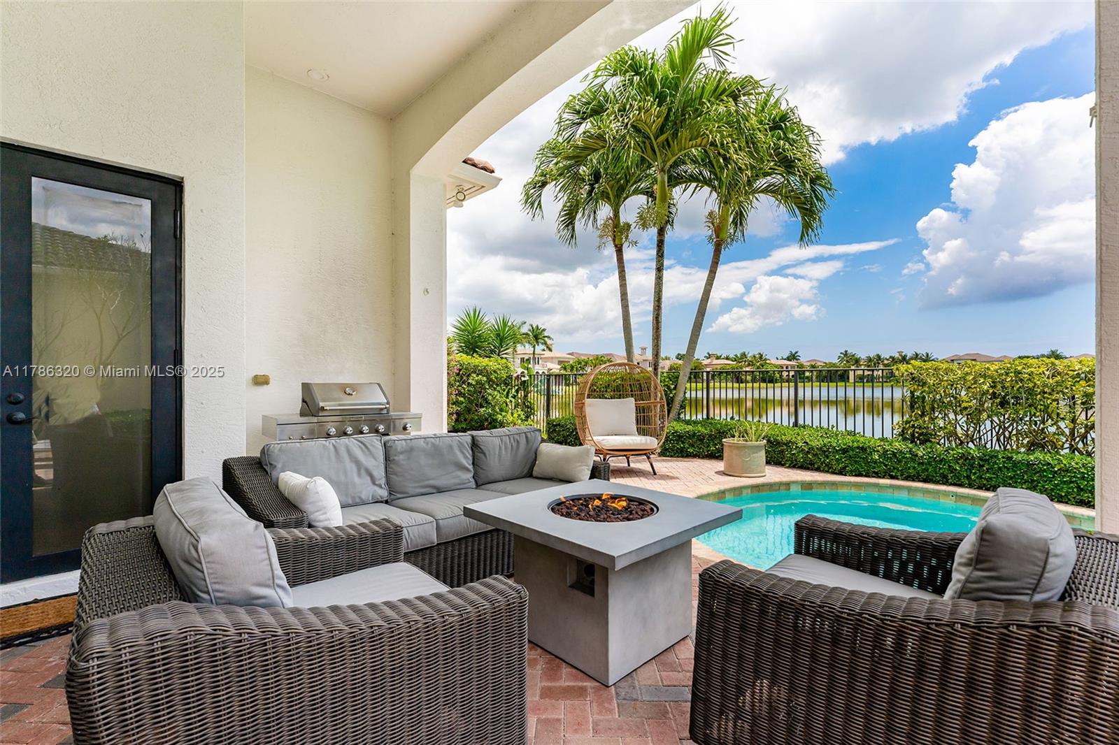 17937 Villa Club Way Boca Raton, FL 33496 - Photo 37 of 41 a outdoor space with patio couch and a garden