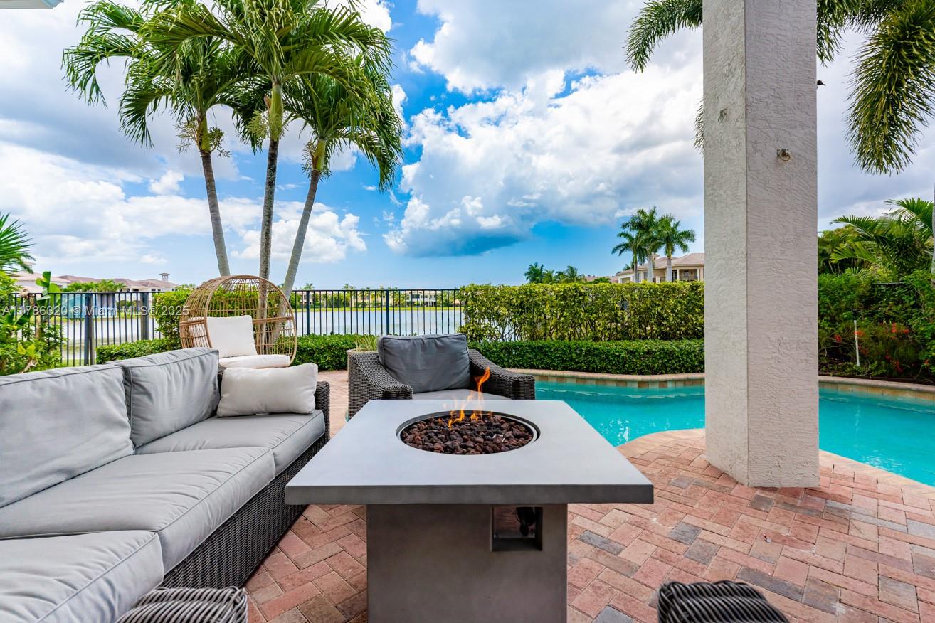 17937 Villa Club Way Boca Raton, FL 33496 - Photo 39 of 41 a view of a patio with couches potted plants and a big yard