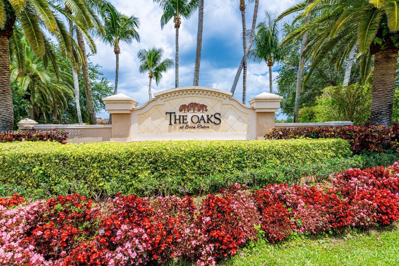 17937 Villa Club Way Boca Raton, FL 33496 - Photo 41 of 41 a sign that is sitting in front of flowers