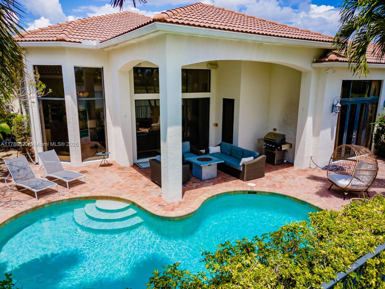 17937 Villa Club Way Boca Raton, FL 33496 - Photo 5 of 41 a view of a house with backyard and porch