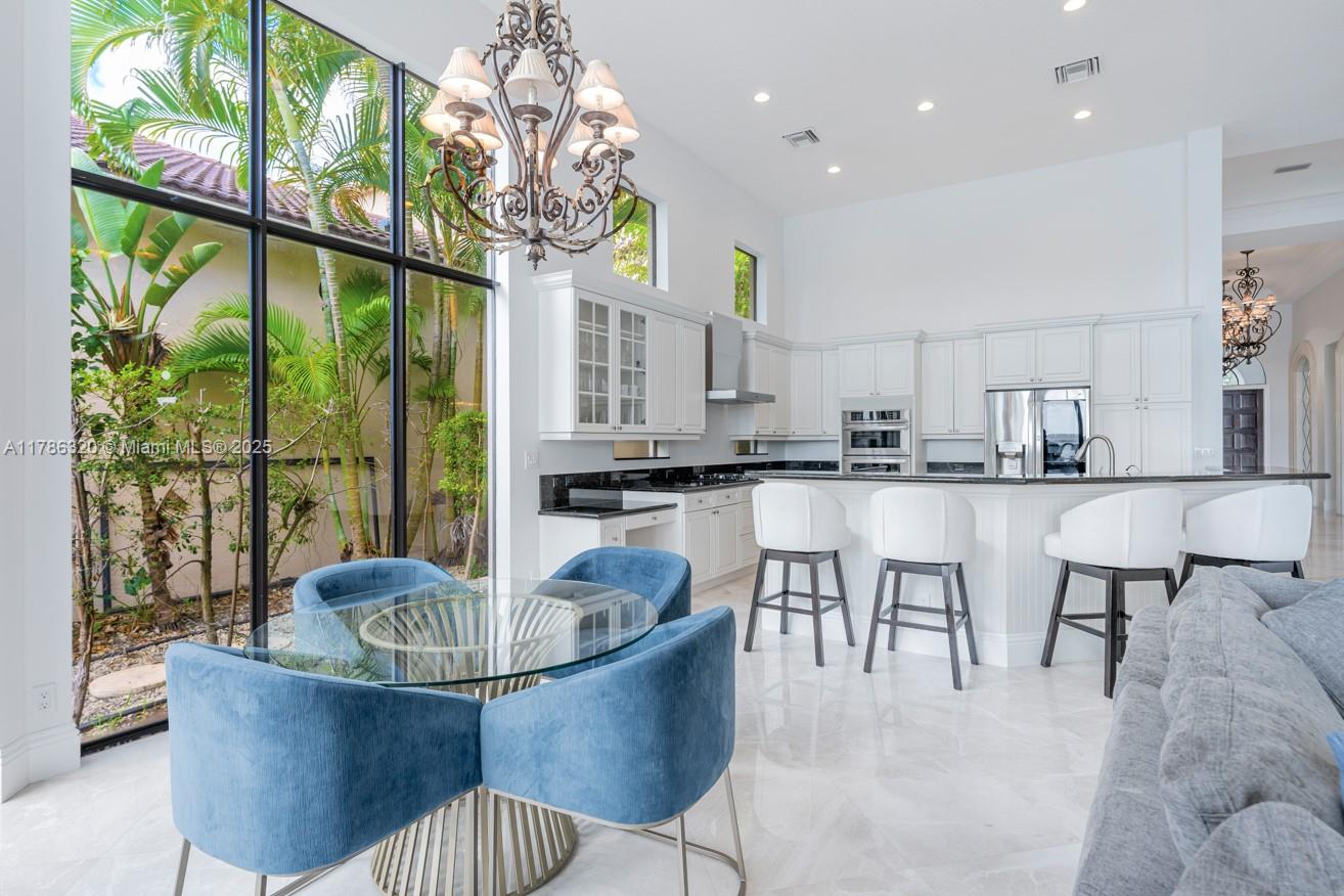 17937 Villa Club Way Boca Raton, FL 33496 - Photo 6 of 41 a living room with furniture and a large window