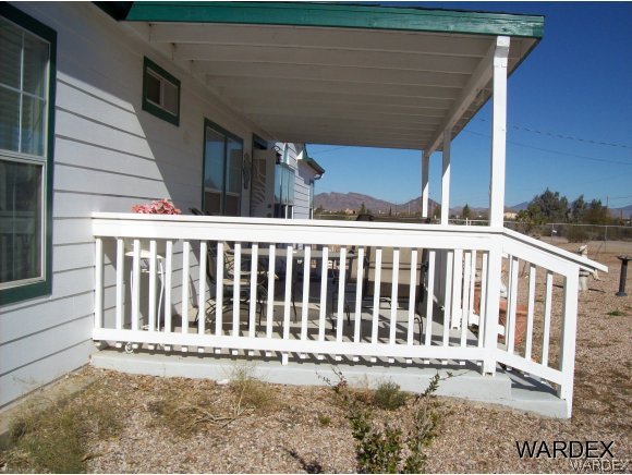 4029 Canelo Road Golden Valley, AZ 86413 - Photo 15 of 15 a view of a house with wooden fence