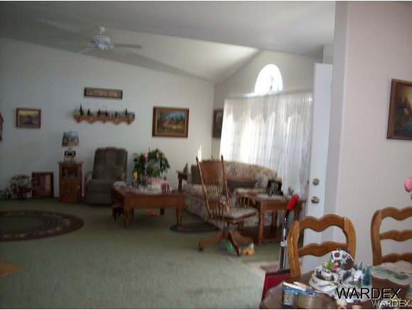 4029 Canelo Road Golden Valley, AZ 86413 - Photo 9 of 15 a living room with furniture and a chandelier
