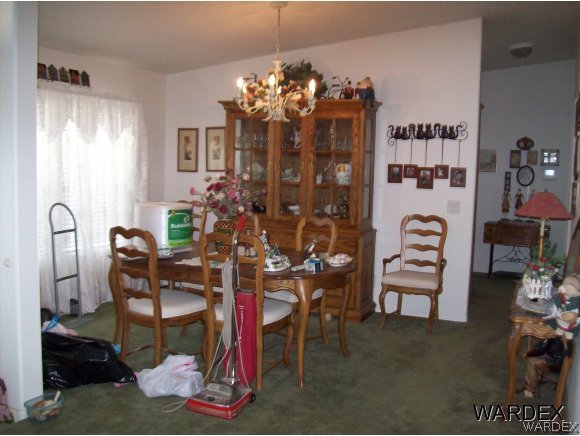 4029 Canelo Road Golden Valley, AZ 86413 - Photo 10 of 15 a view of a dining room with furniture and chandelier