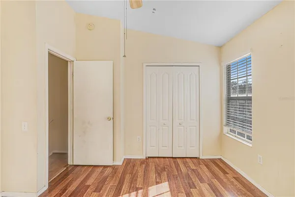a view of room with window and hardwood floor
