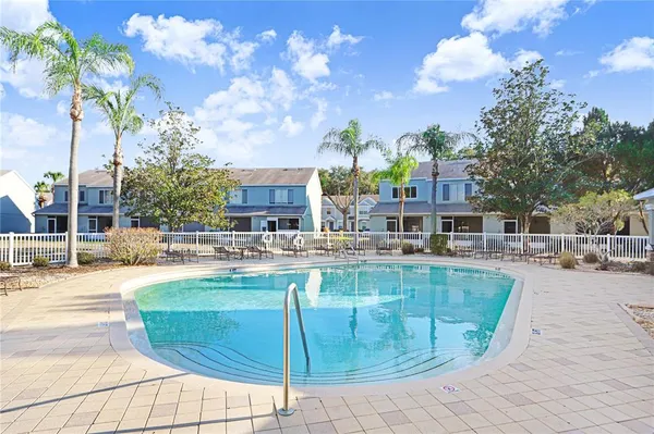 a view of a swimming pool with lounge chair