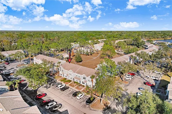 an aerial view of residential houses with outdoor space