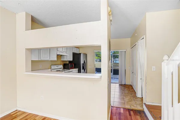 a view of living room with furniture and wooden floor