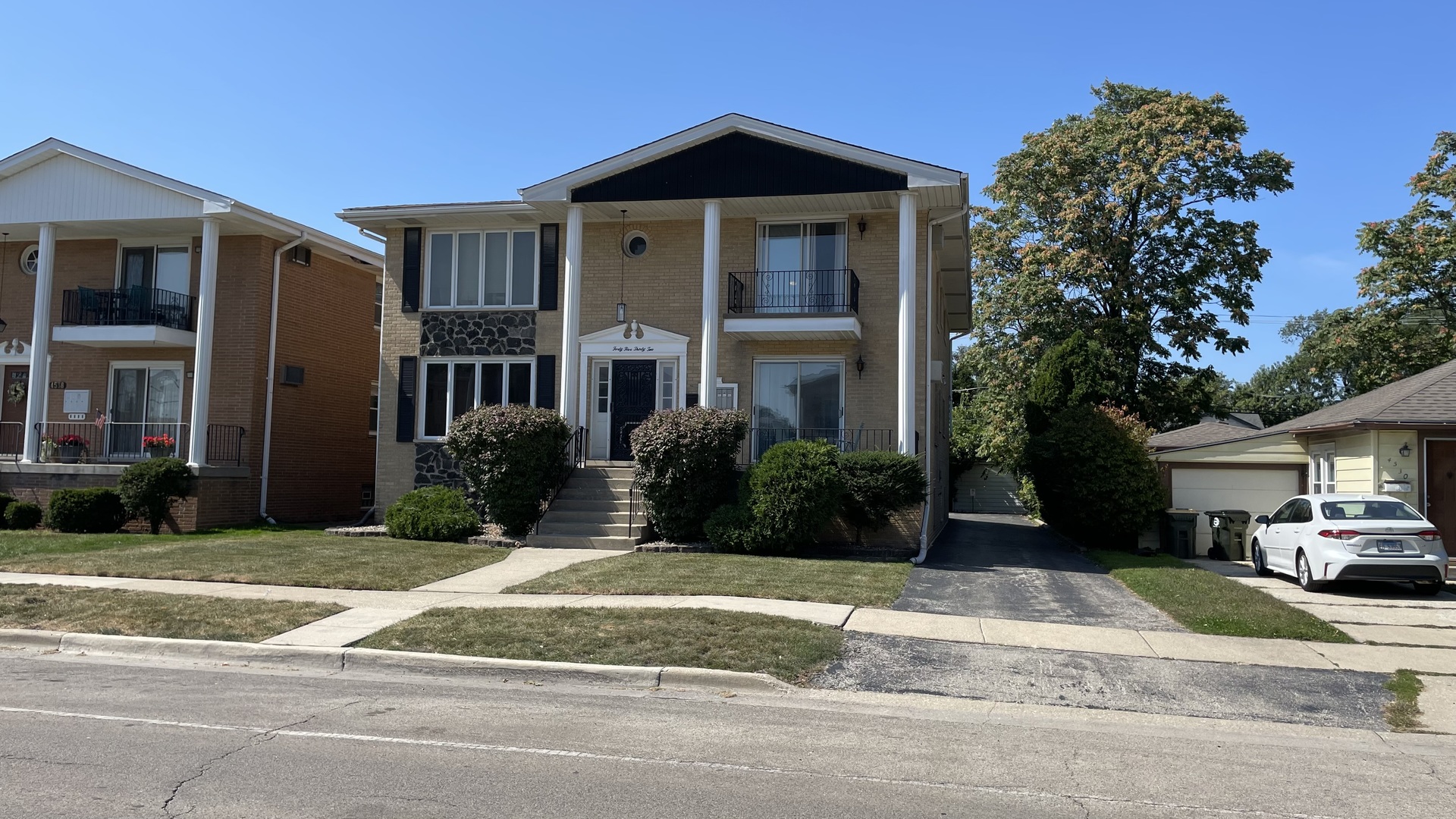 4532 Maple Avenue, Unit 2 Brookfield, IL 60513 - Photo 1 of 1 a front view of a house with a yard