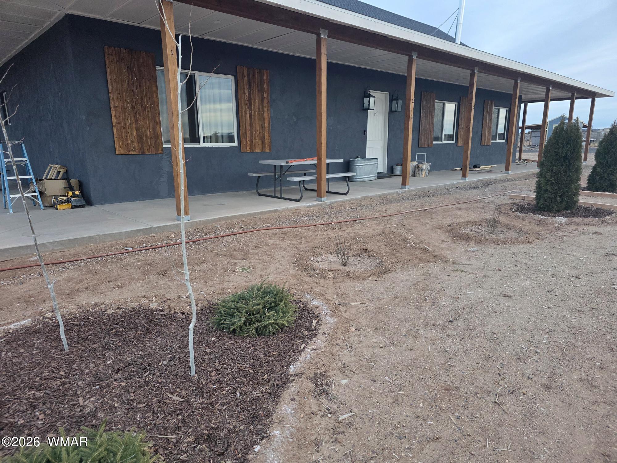 5057 Churchill Road Snowflake, AZ 85937 - Photo 11 of 115 a view of a house with backyard and porch