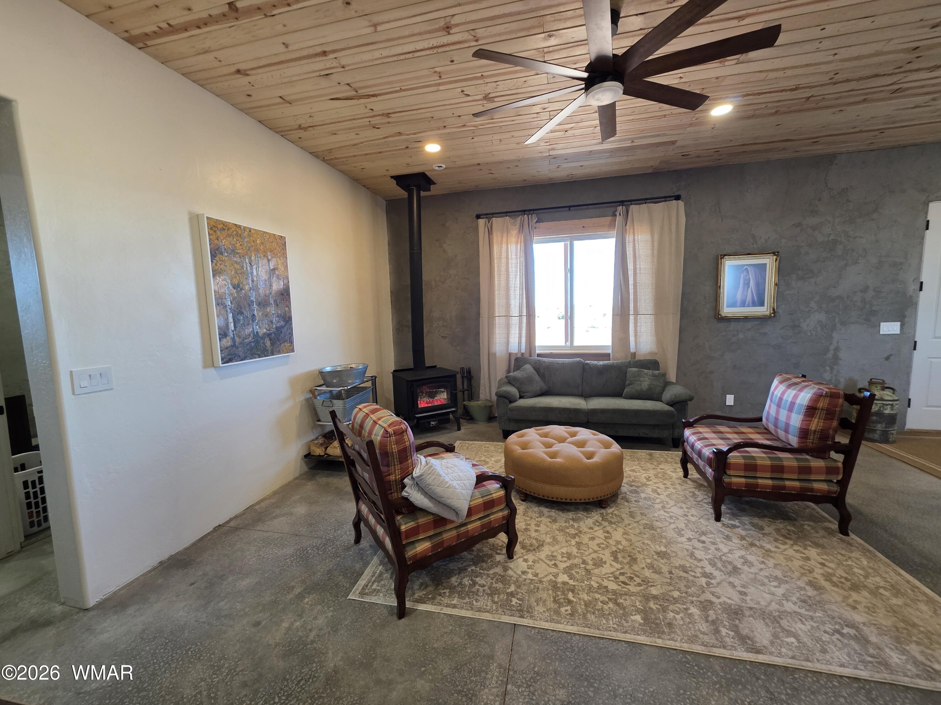 5057 Churchill Road Snowflake, AZ 85937 - Photo 13 of 115 a living room with furniture and a window