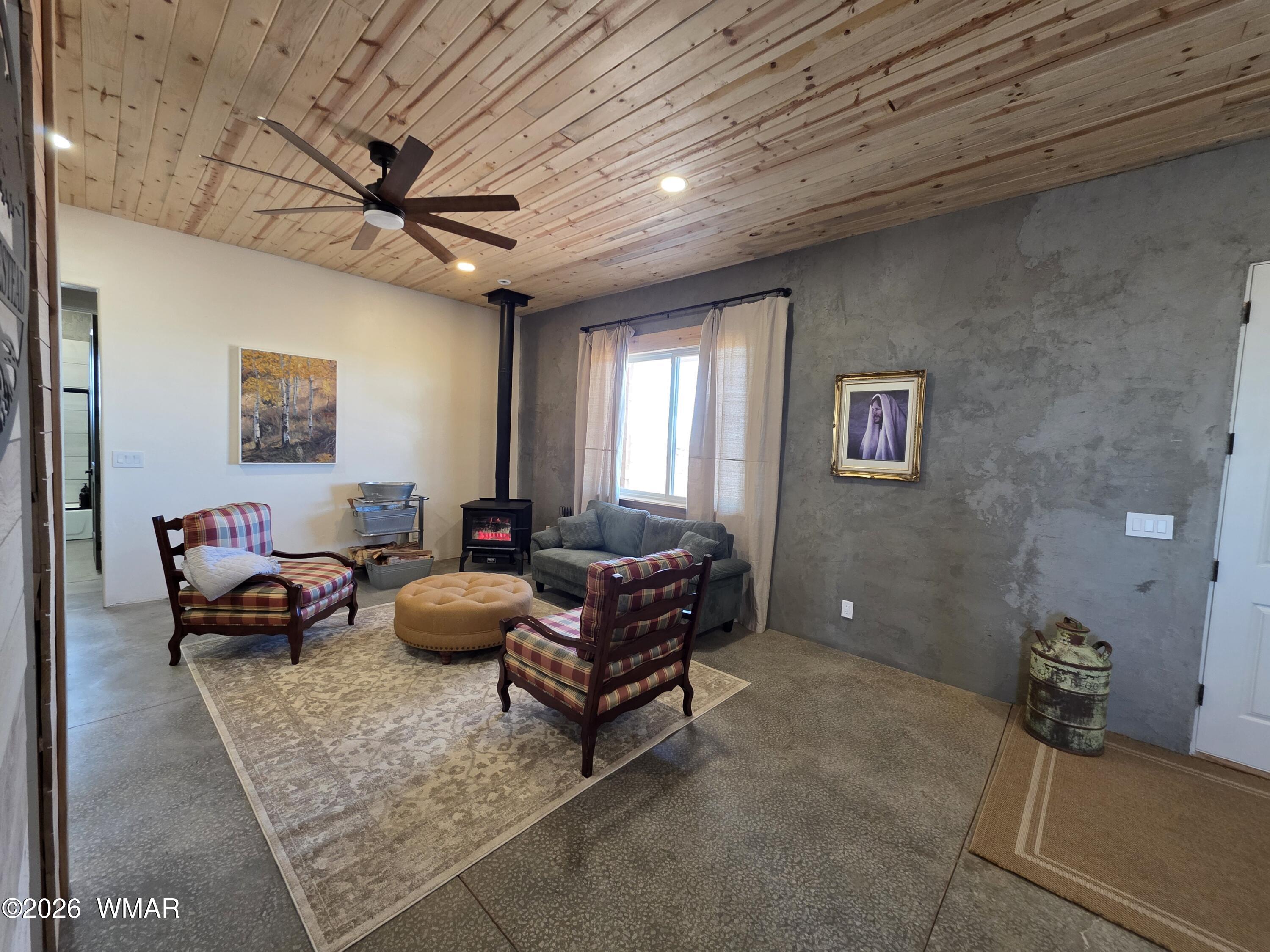5057 Churchill Road Snowflake, AZ 85937 - Photo 14 of 115 a living room with furniture and a ceiling fan