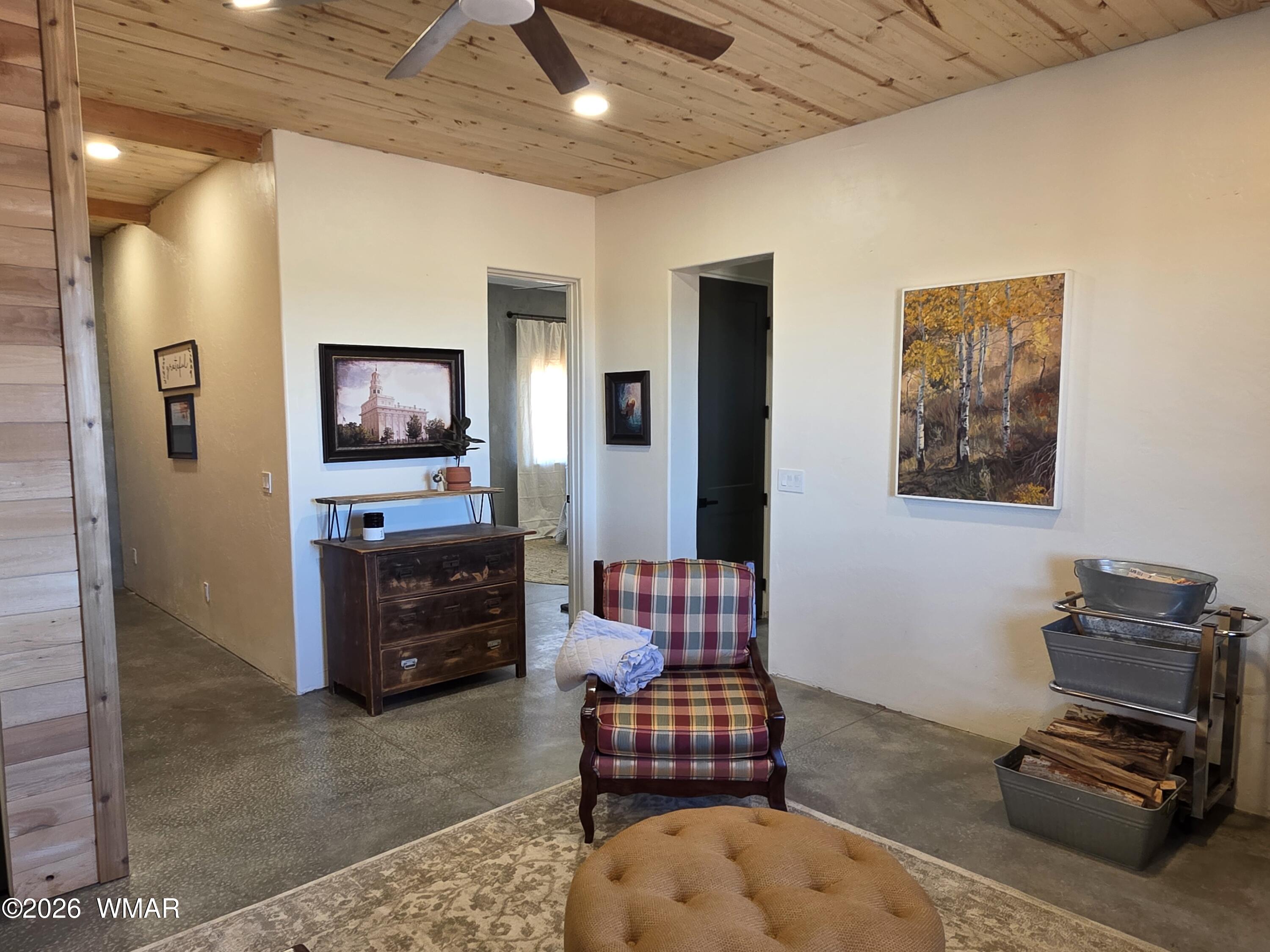 5057 Churchill Road Snowflake, AZ 85937 - Photo 15 of 115 a living room with furniture and a flat screen tv