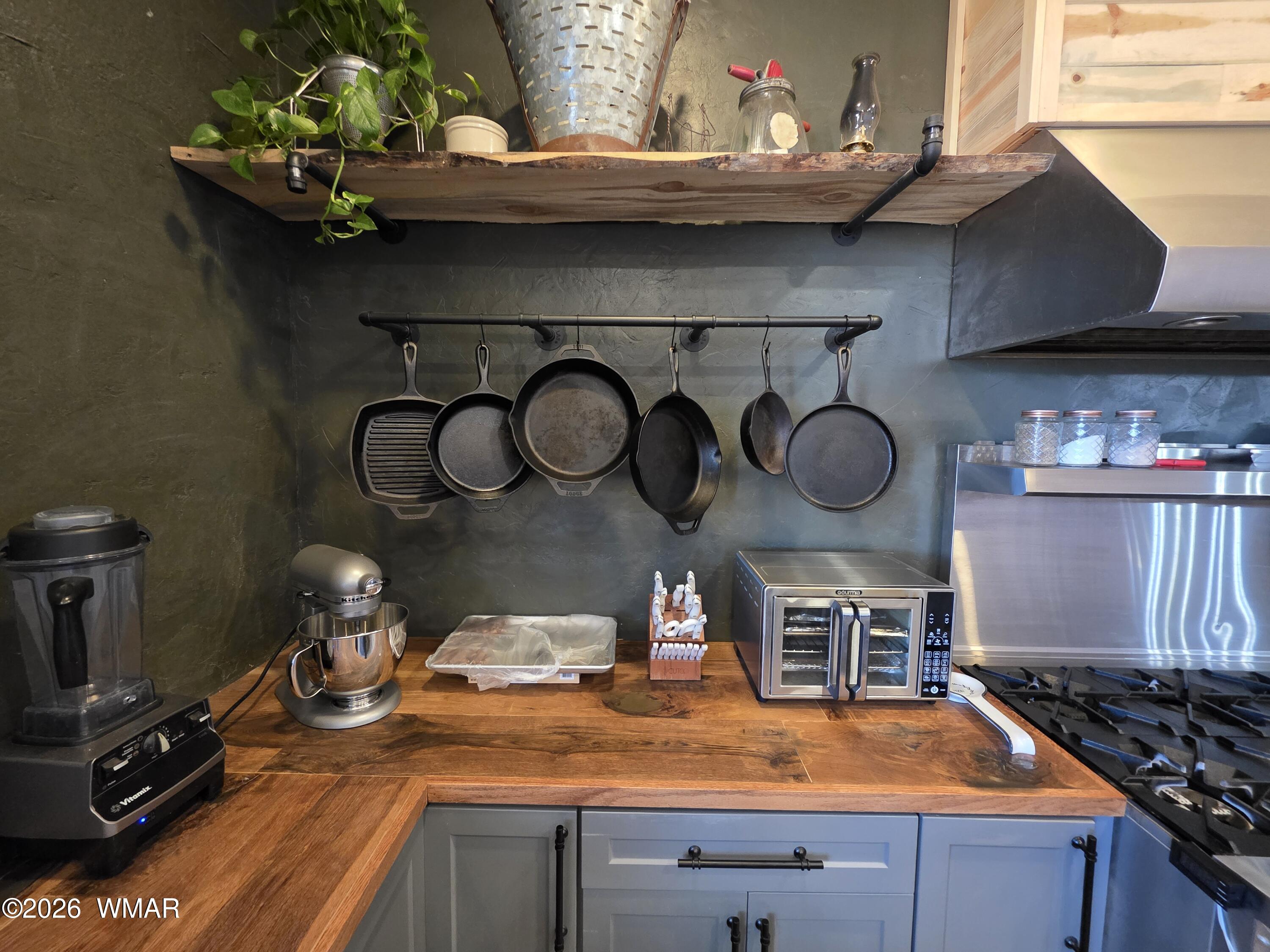 5057 Churchill Road Snowflake, AZ 85937 - Photo 23 of 115 a kitchen with a stove and a wooden floor