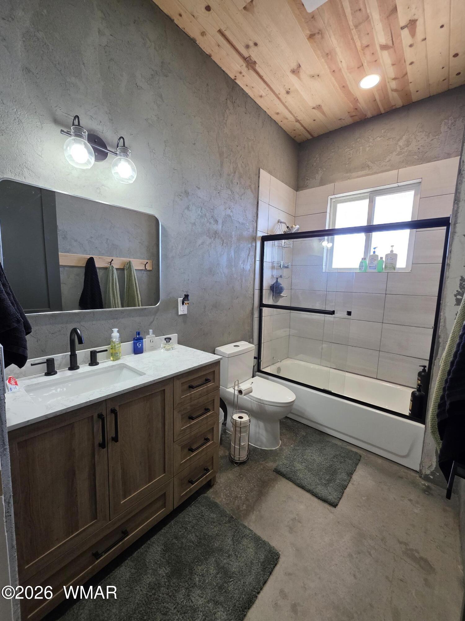 5057 Churchill Road Snowflake, AZ 85937 - Photo 31 of 115 a spacious bathroom with a double vanity sink a toilet and mirror