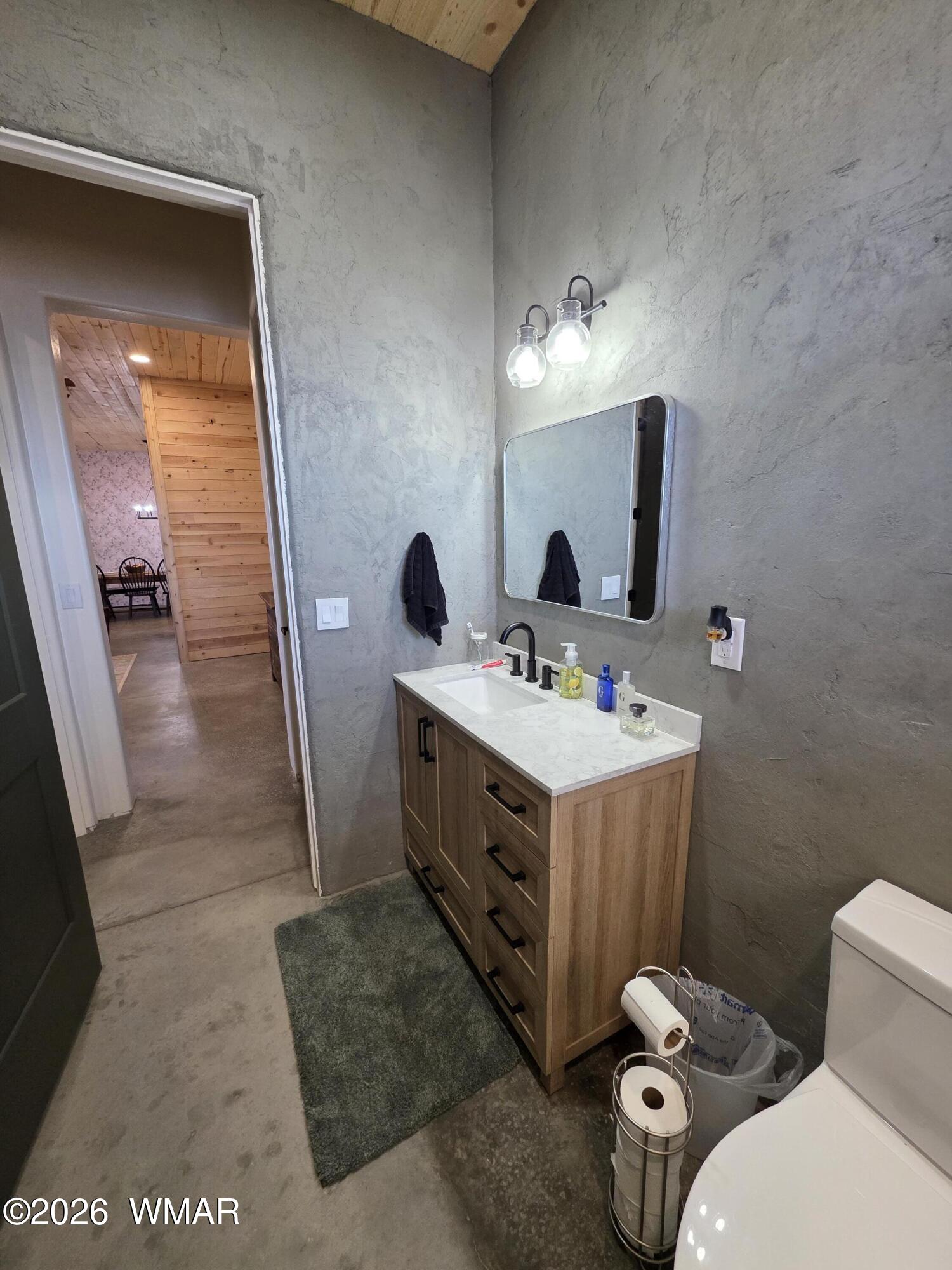 5057 Churchill Road Snowflake, AZ 85937 - Photo 32 of 115 a bathroom with a double vanity sink mirror and toilet