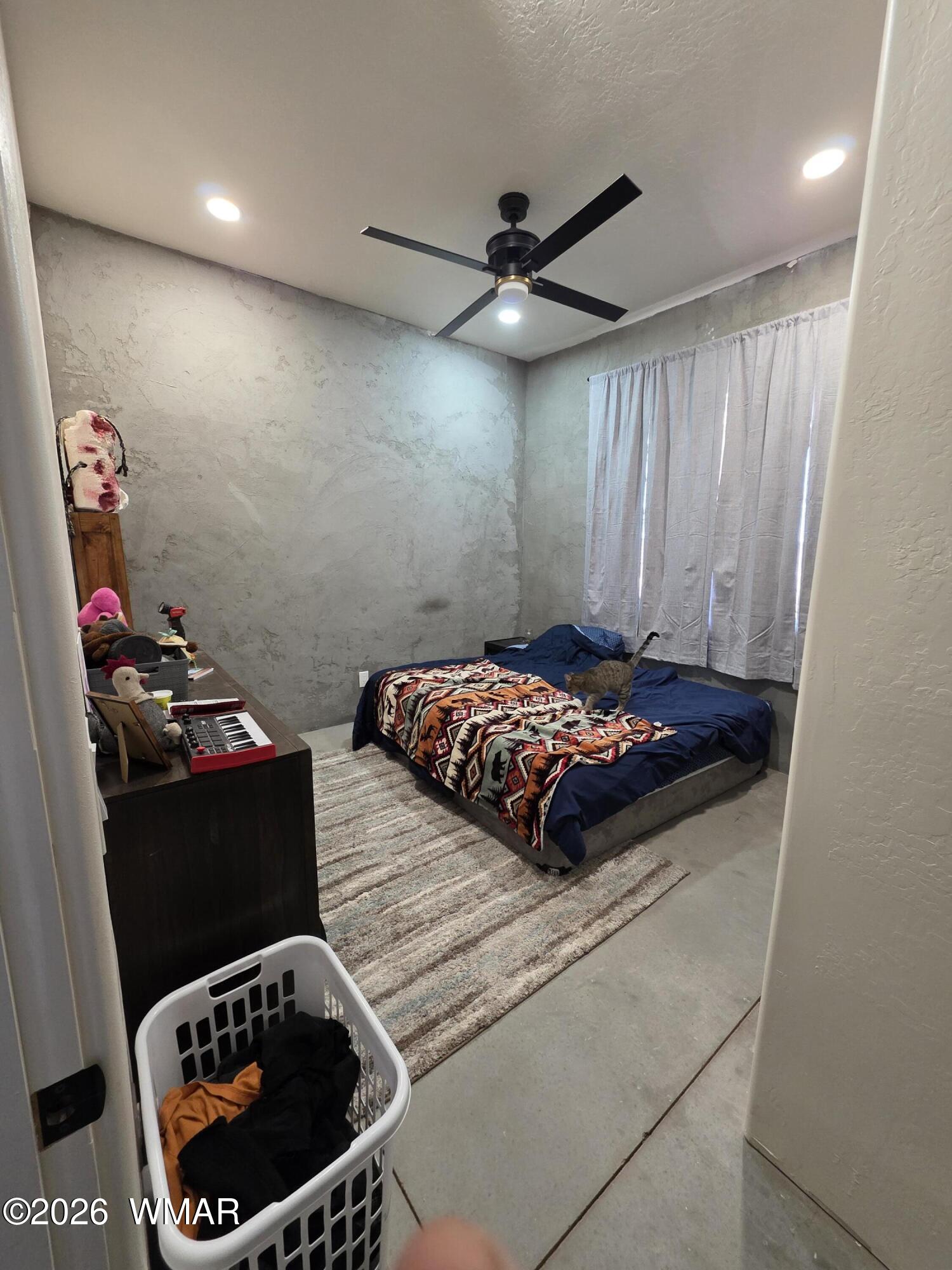 5057 Churchill Road Snowflake, AZ 85937 - Photo 37 of 115 a bedroom with a bed and a dresser