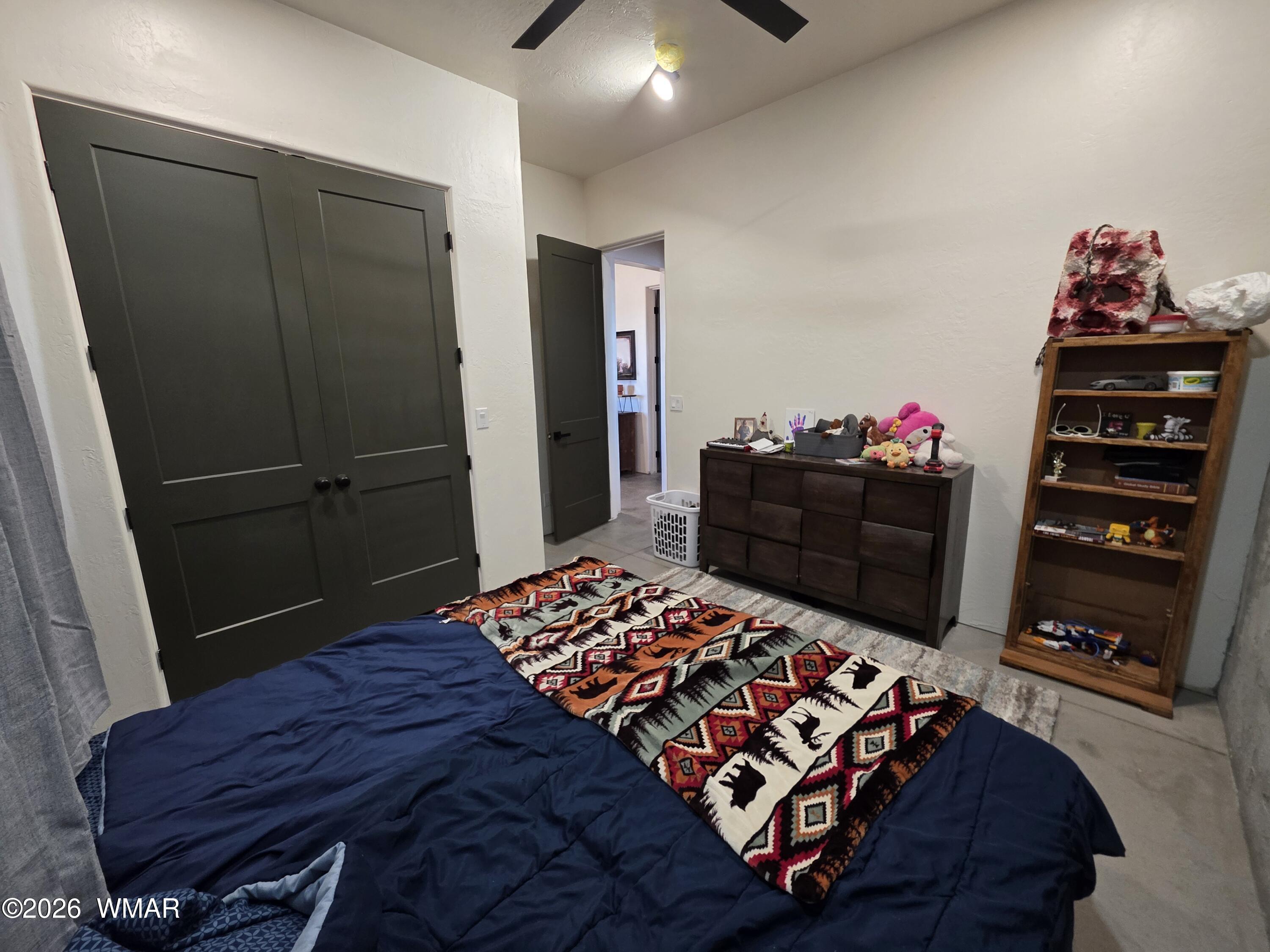 5057 Churchill Road Snowflake, AZ 85937 - Photo 38 of 115 a bedroom with a bed and a dresser