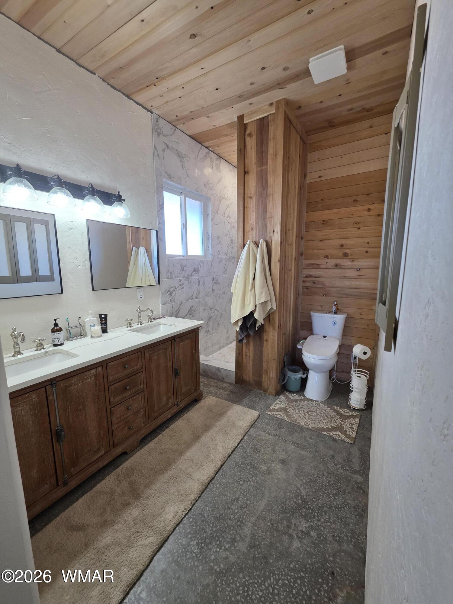 5057 Churchill Road Snowflake, AZ 85937 - Photo 44 of 115 a spacious bathroom with a double vanity sink and mirror