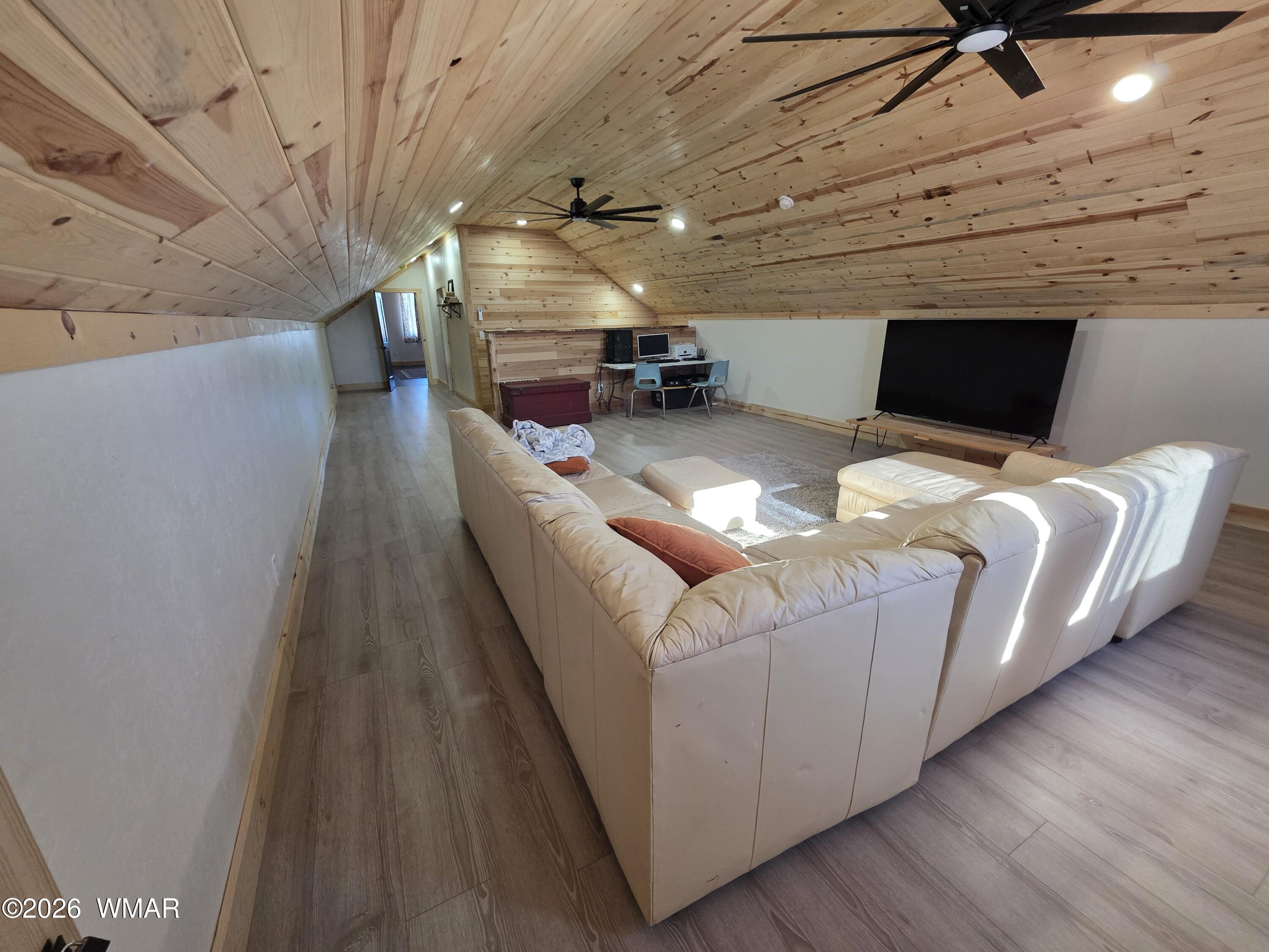 5057 Churchill Road Snowflake, AZ 85937 - Photo 53 of 115 a room with furniture and a flat screen tv