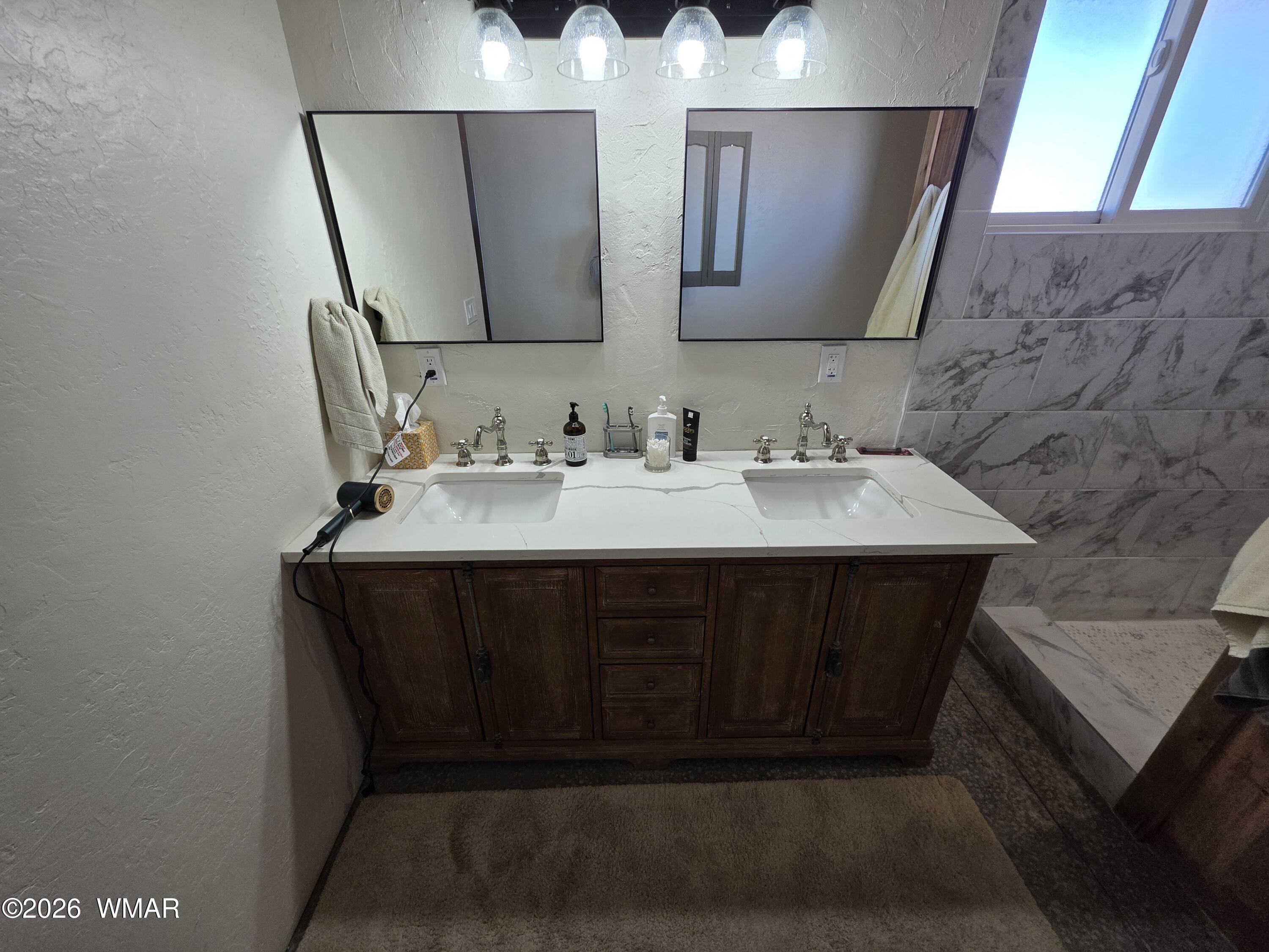 5057 Churchill Road Snowflake, AZ 85937 - Photo 64 of 115 a bathroom with a sink vanity and mirror