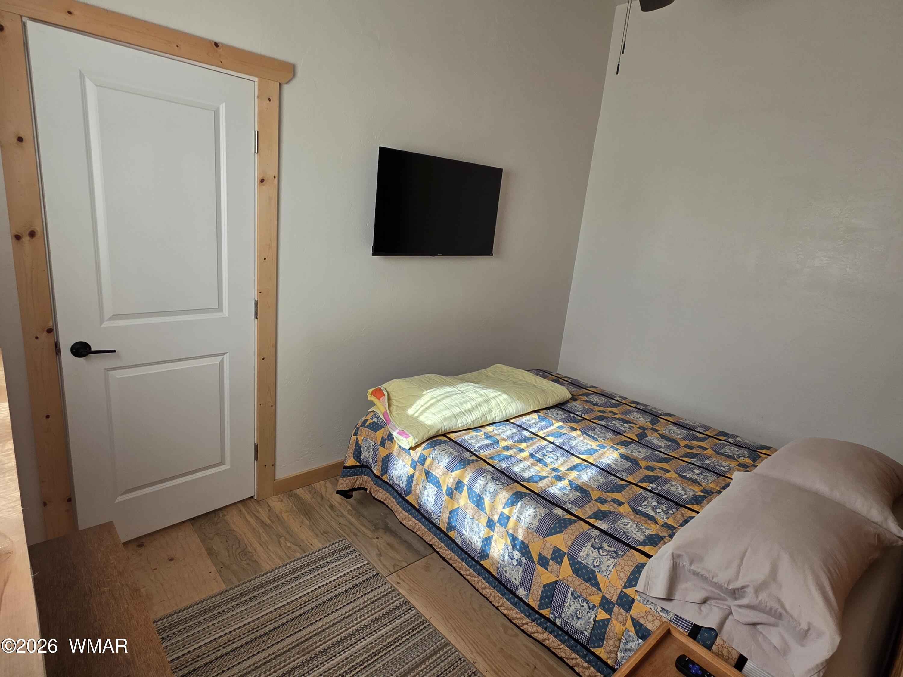 5057 Churchill Road Snowflake, AZ 85937 - Photo 81 of 115 a bedroom with a bed and a flat screen tv