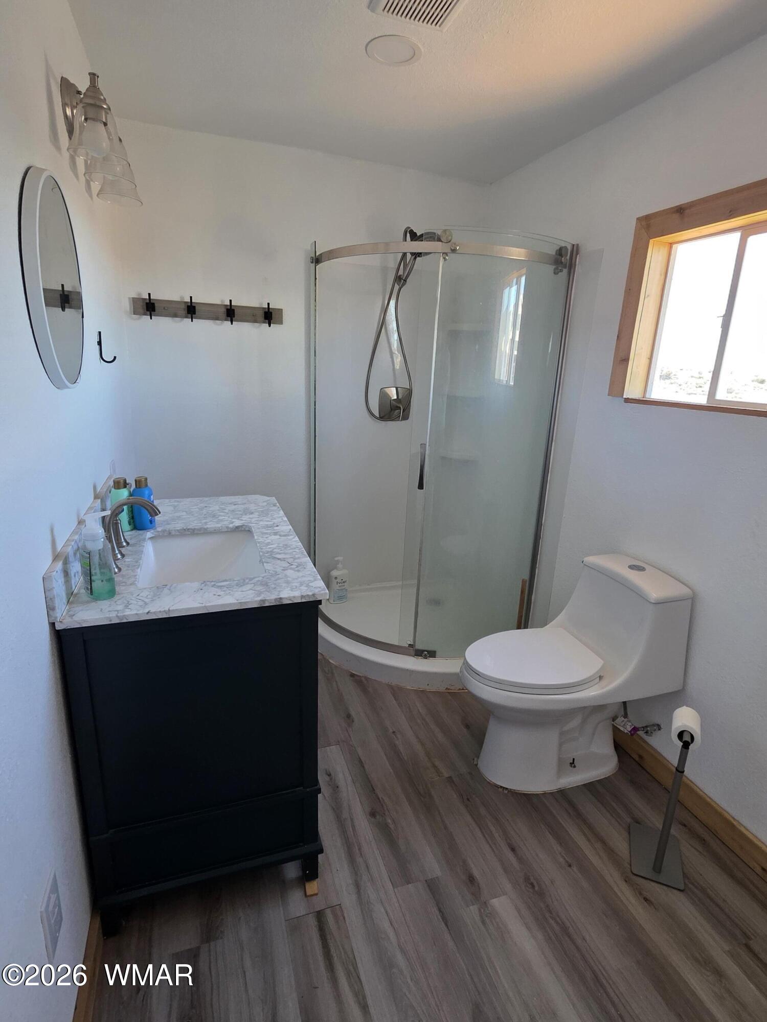 5057 Churchill Road Snowflake, AZ 85937 - Photo 93 of 115 a bathroom with a sink a toilet and shower