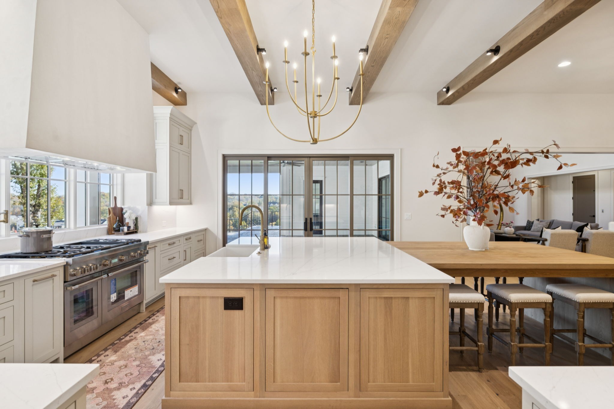 8101 Heirloom Boulevard College Grove, TN 37046 - Photo 24 of 81 a kitchen with stainless steel appliances kitchen island granite countertop a stove a sink a dining table and chairs