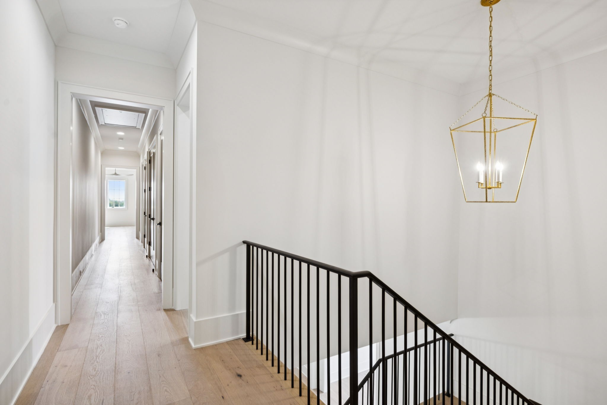 8101 Heirloom Boulevard College Grove, TN 37046 - Photo 47 of 81 a view of a hallway with wooden floor and a chandelier