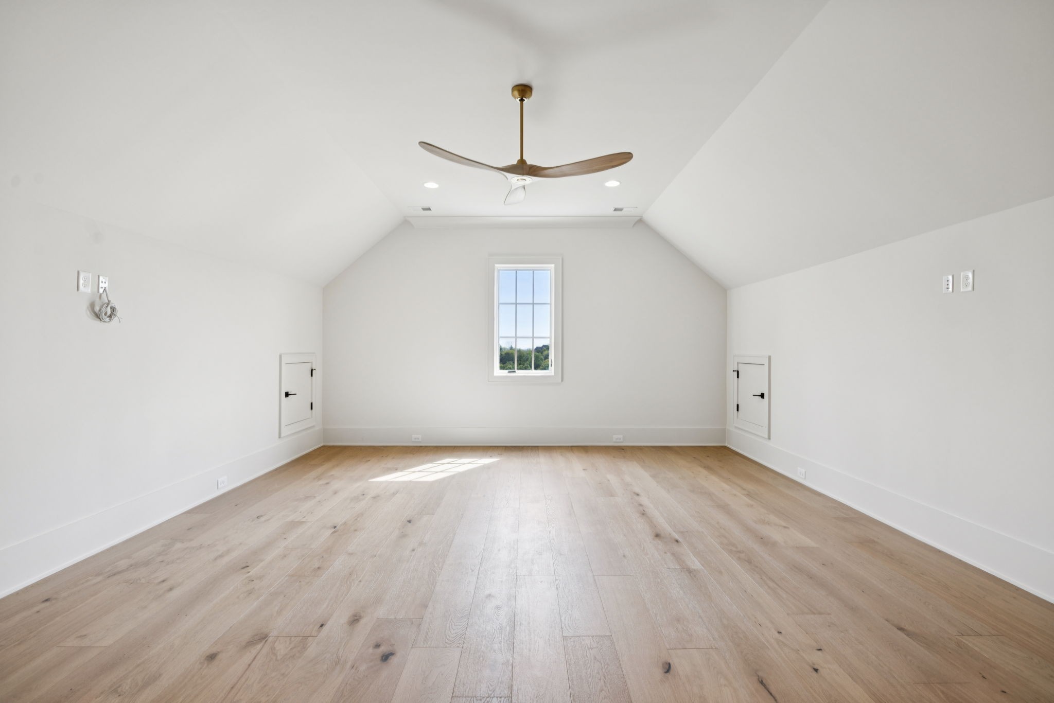 8101 Heirloom Boulevard College Grove, TN 37046 - Photo 48 of 81 an empty room with wooden floor chandelier and windows