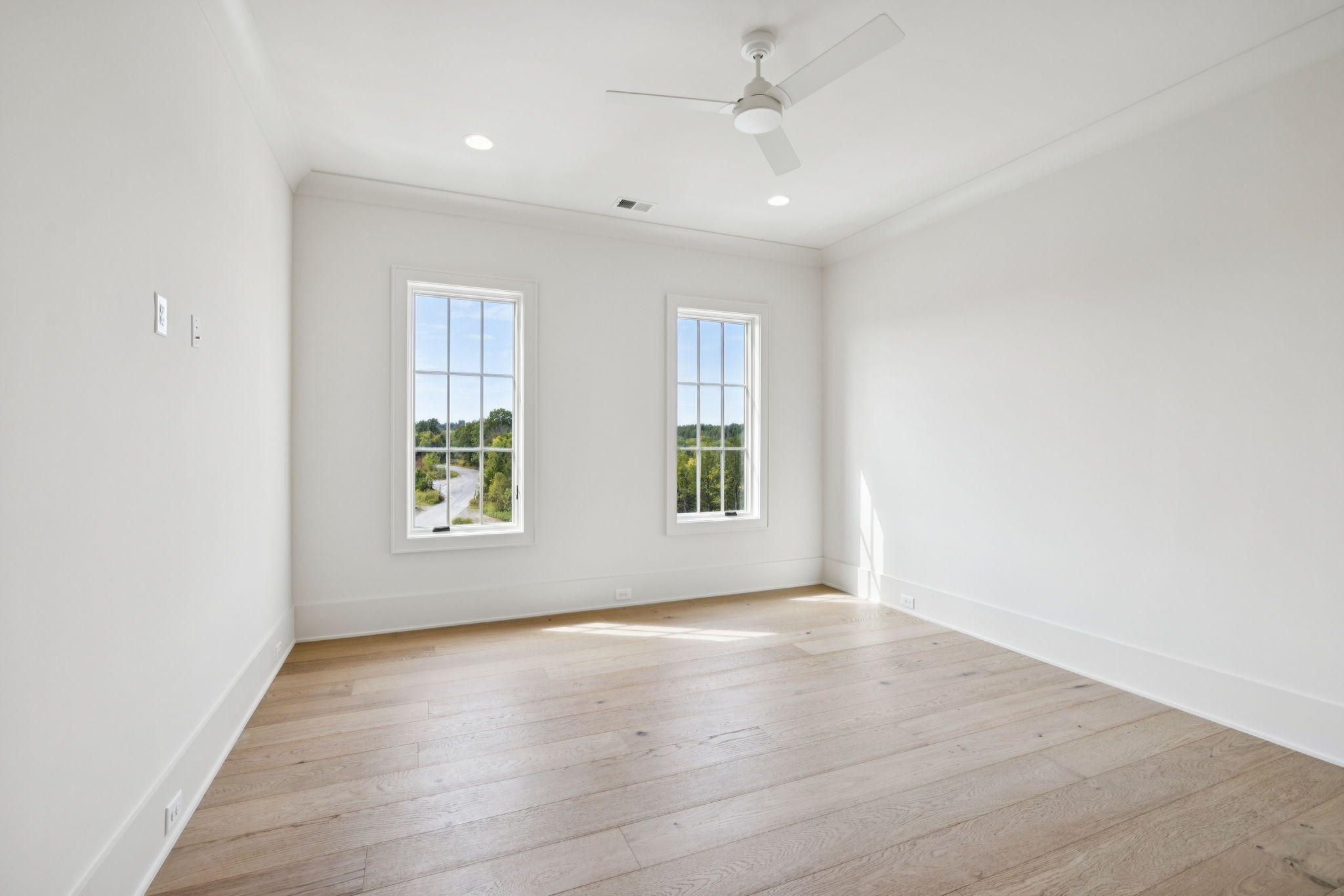 8101 Heirloom Boulevard College Grove, TN 37046 - Photo 51 of 81 an empty room with wooden floor and windows
