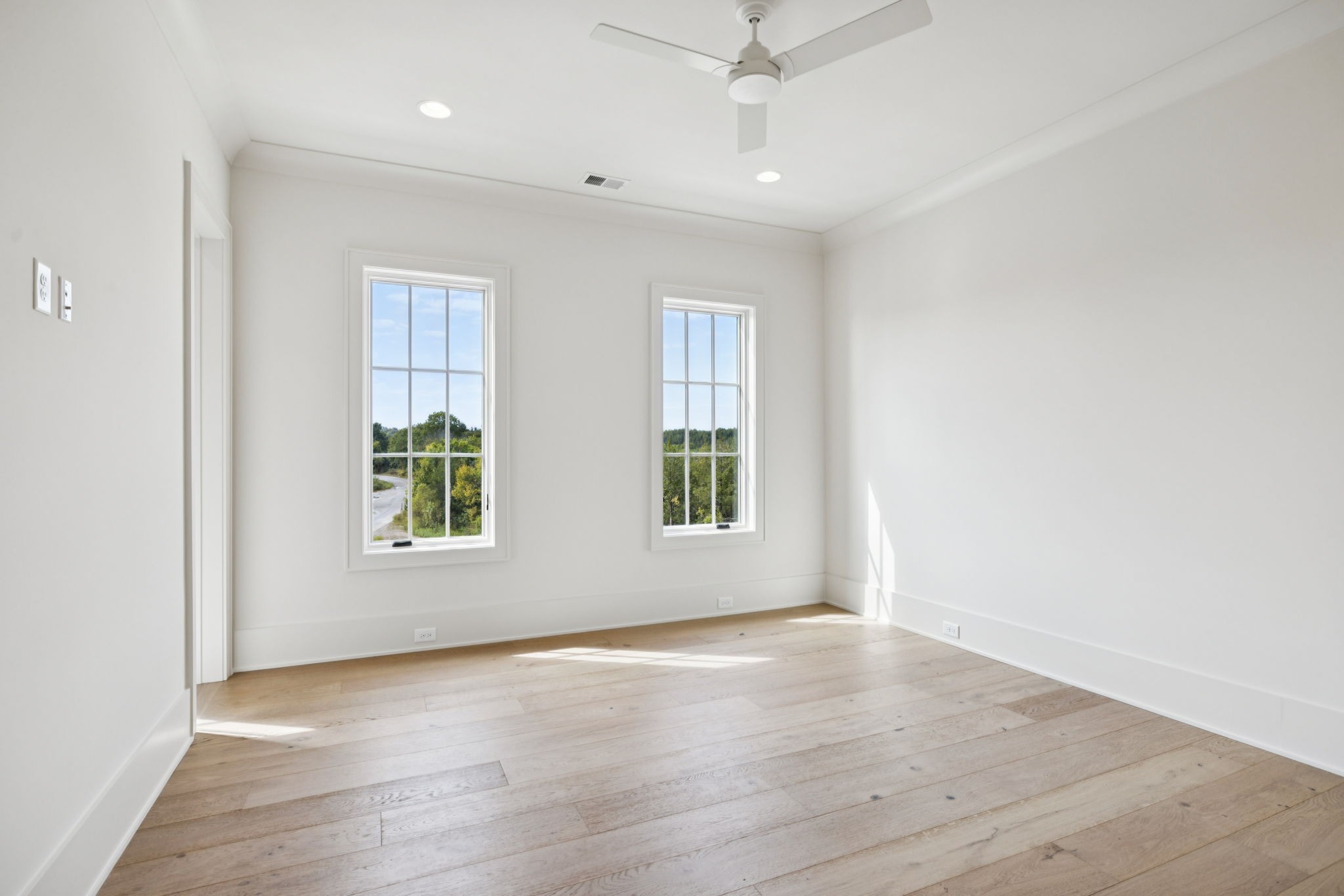 8101 Heirloom Boulevard College Grove, TN 37046 - Photo 54 of 81 an empty room with wooden floor and windows