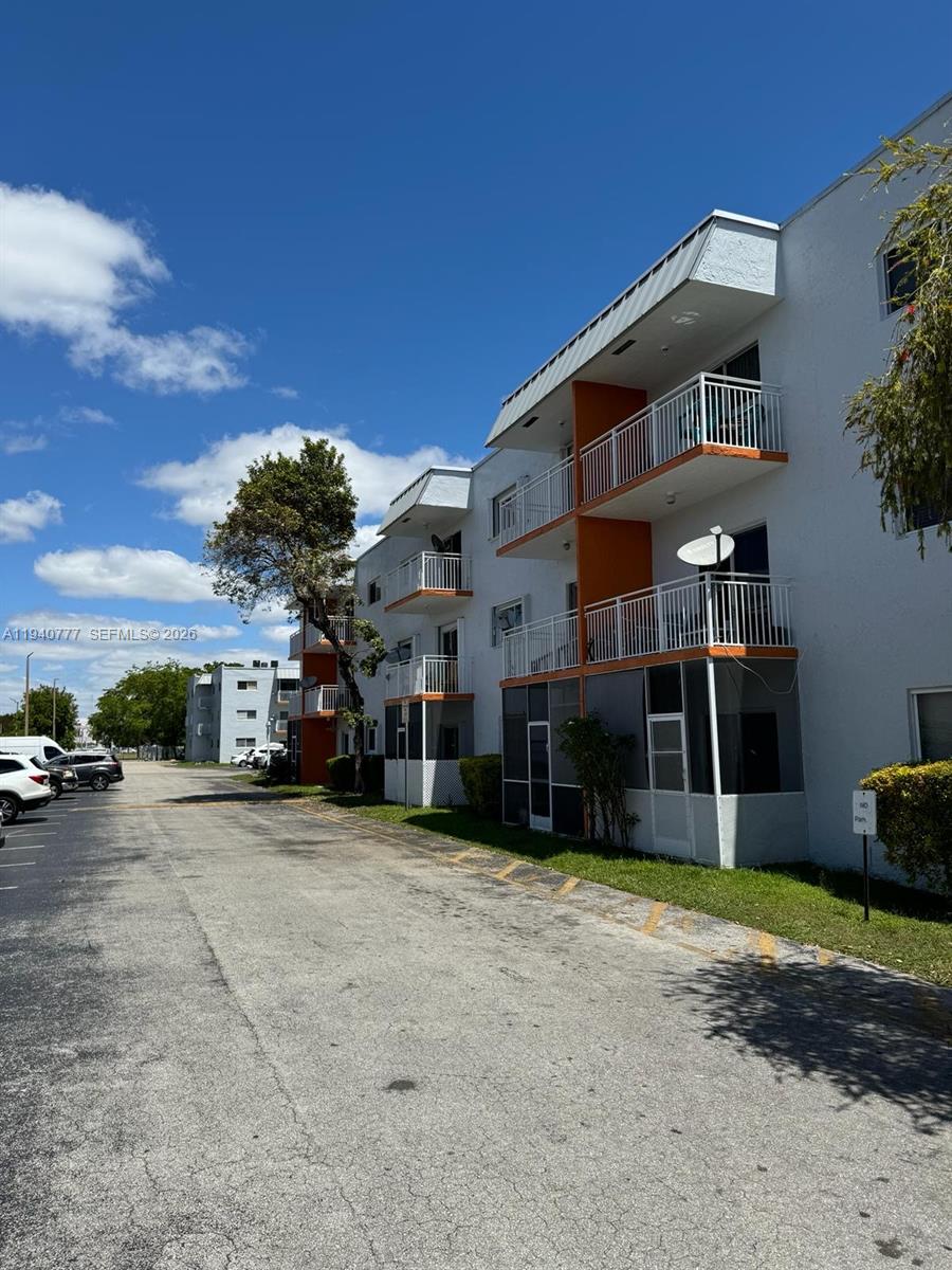 11307 Southwest 200th Street, Unit 310B Miami, FL 33157 - Photo 13 of 14 a view of a house with backyard and sitting area