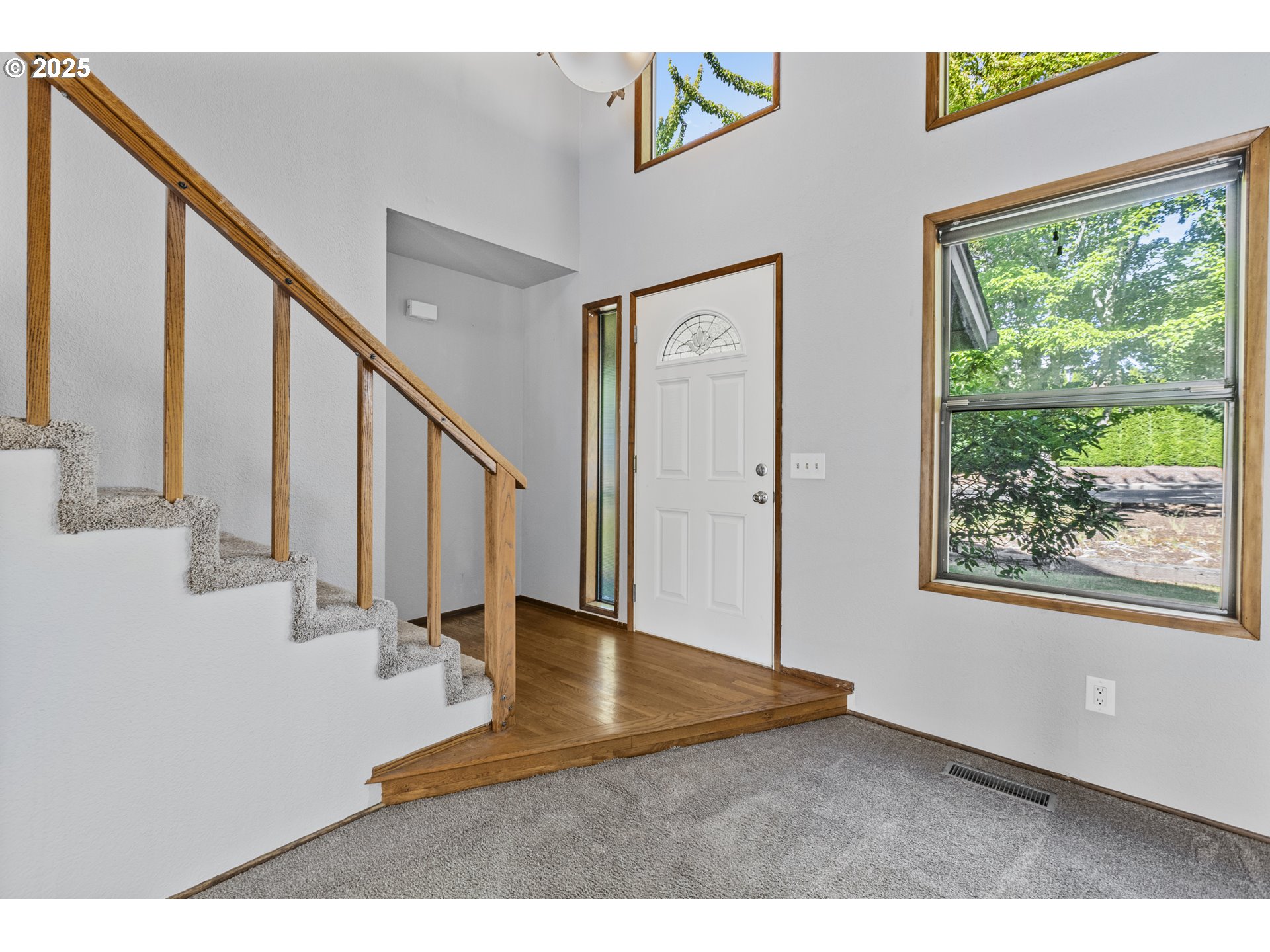 2641 Northwest Crocker Lane Albany, OR 97321 - Photo 11 of 47 a view of an entryway with wooden floor and windows