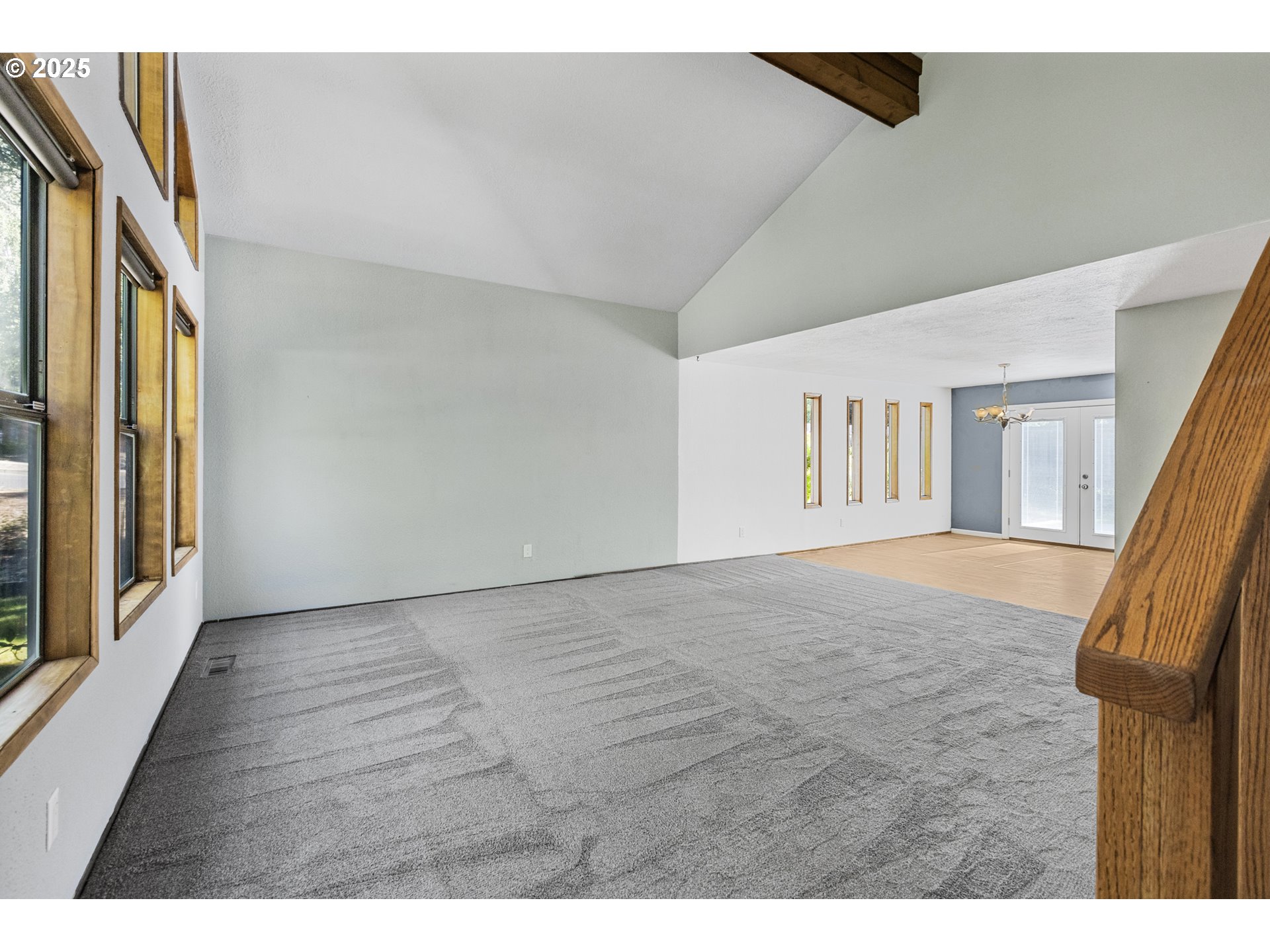 2641 Northwest Crocker Lane Albany, OR 97321 - Photo 12 of 47 a view of an empty room with wooden floor and a window